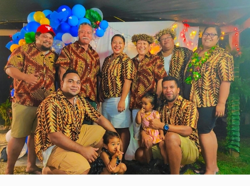 a group of people posing for a photo