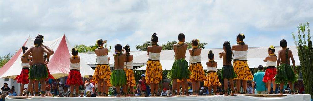 a group of people wearing colorful traditional dresses