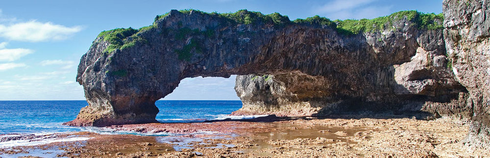 a large rock formation on a beach