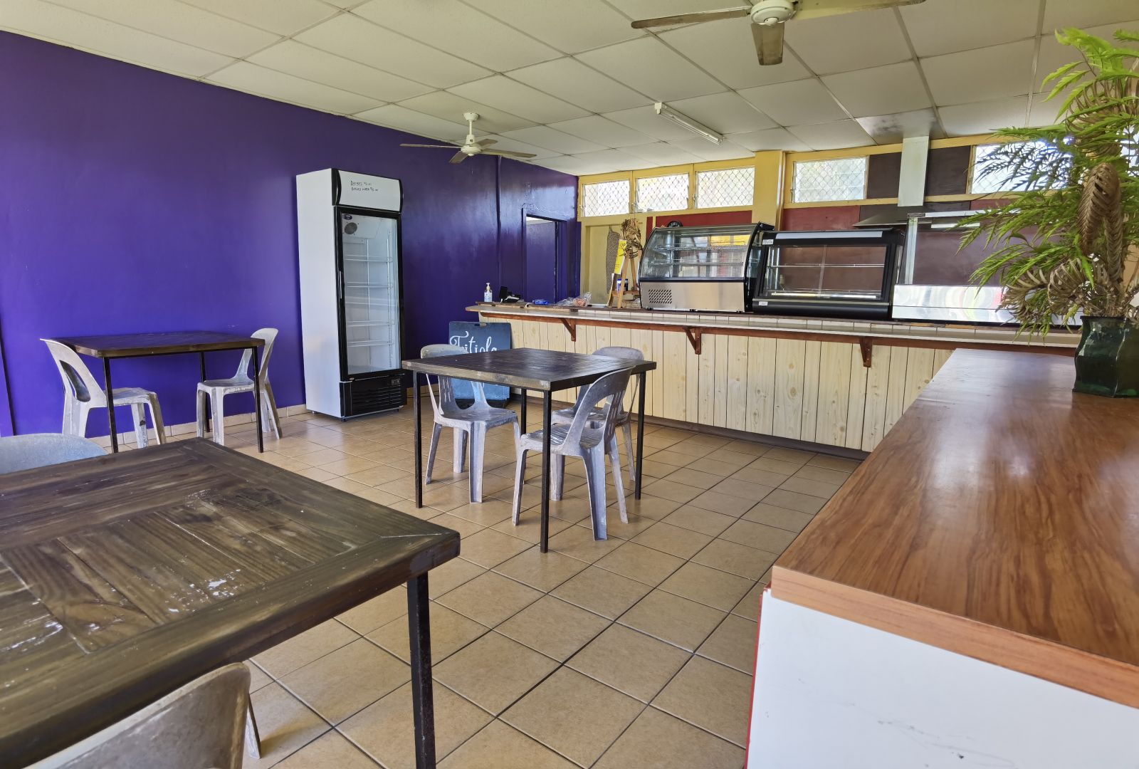 a restaurant with tables and chairs