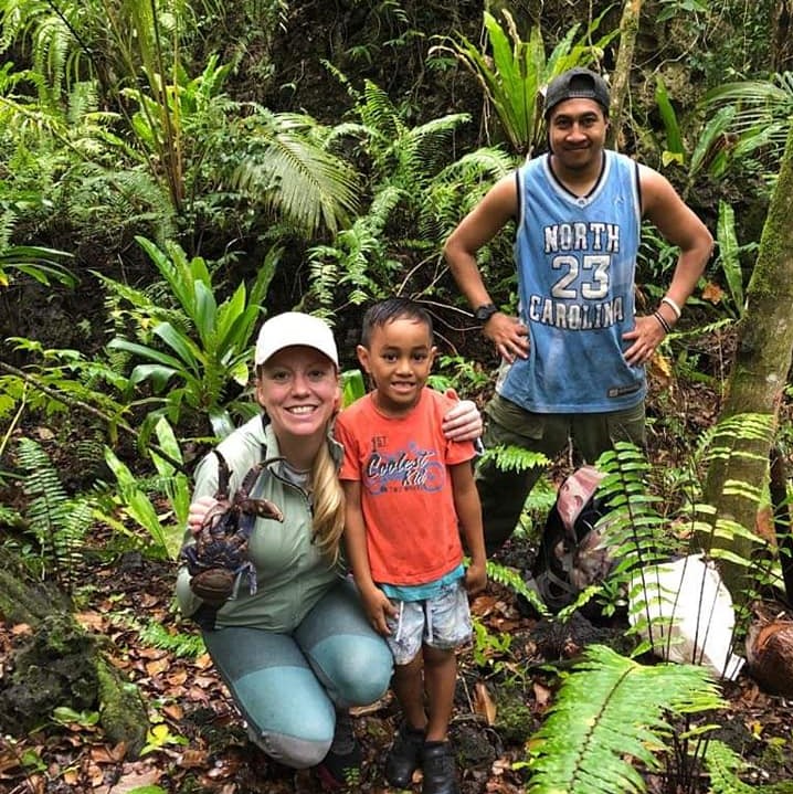 a person and two children posing for a photo