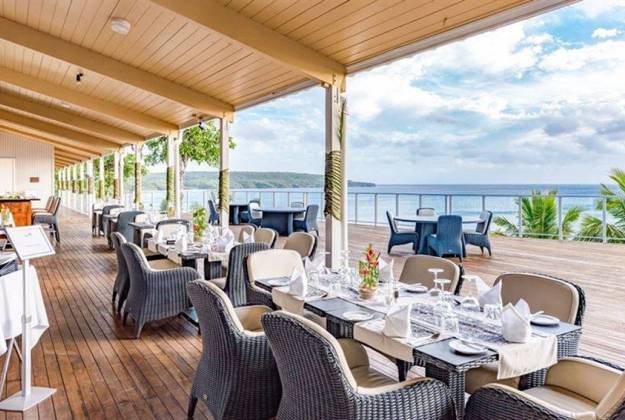 Restaurant on deck by seaside at Scenic Matavi Resort