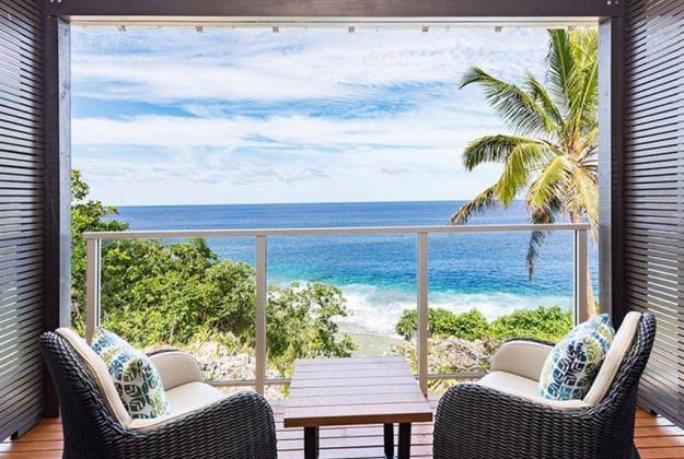 balcony with chairs looking out to the ocean at Scenic Matavi Resort