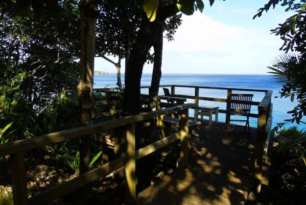 a wooden bench on a beach