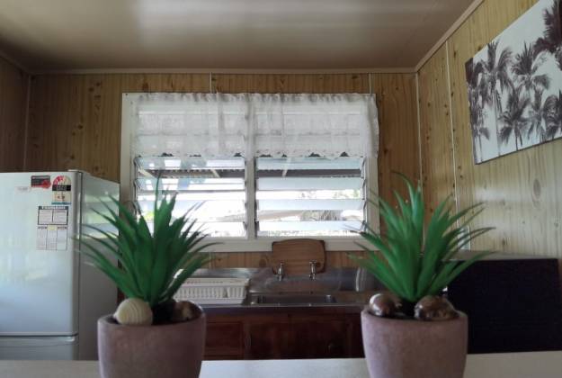 Dining area and couch at accommodation Aliutu Guesthouse