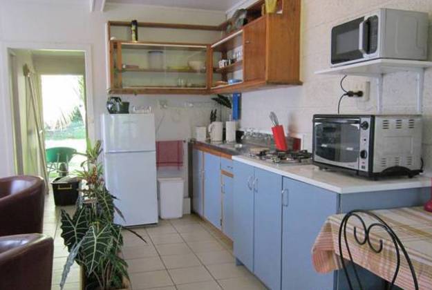 a kitchen with white cabinets