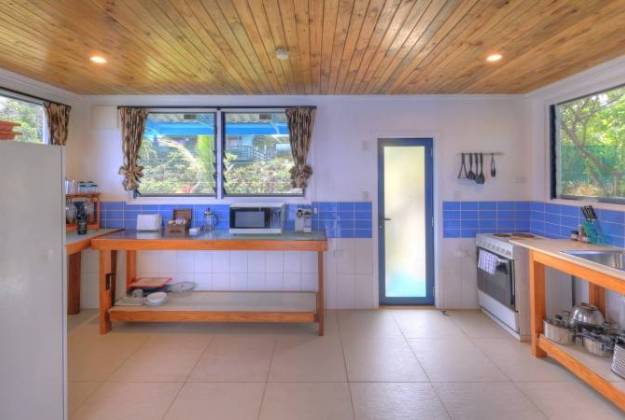 a kitchen with blue tile