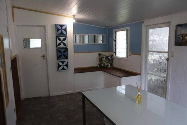a kitchen with a table and a window