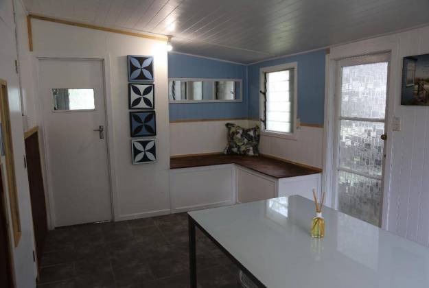 a kitchen with a table and a window