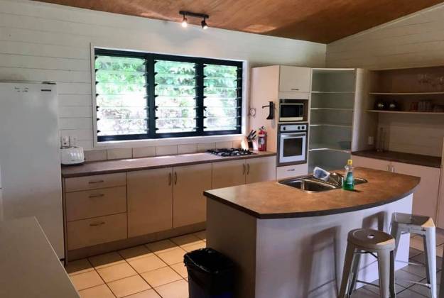 the kitchen of the cottage including kitchen island