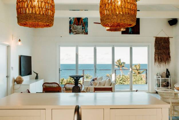 Living area, outside view of Niue and decor of Tuhia sunrise